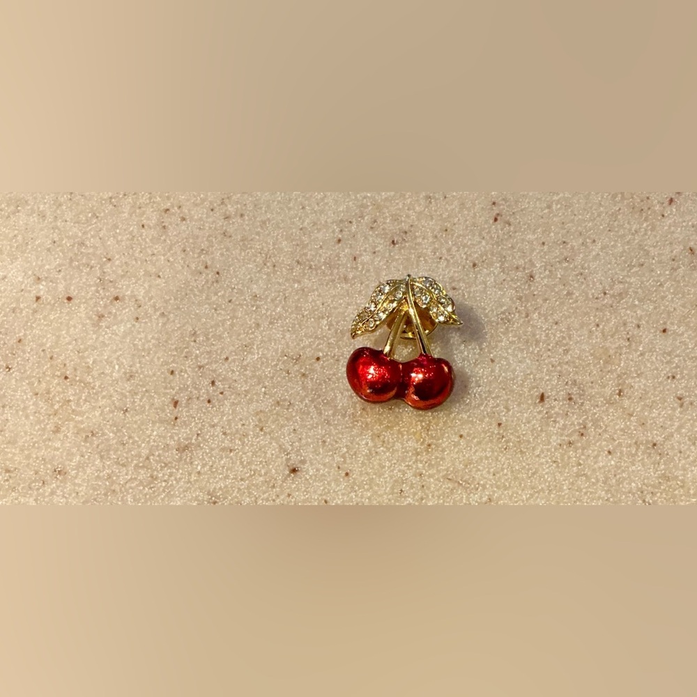 Kenneth Cole Gold and Red Brooch with Elegant Design